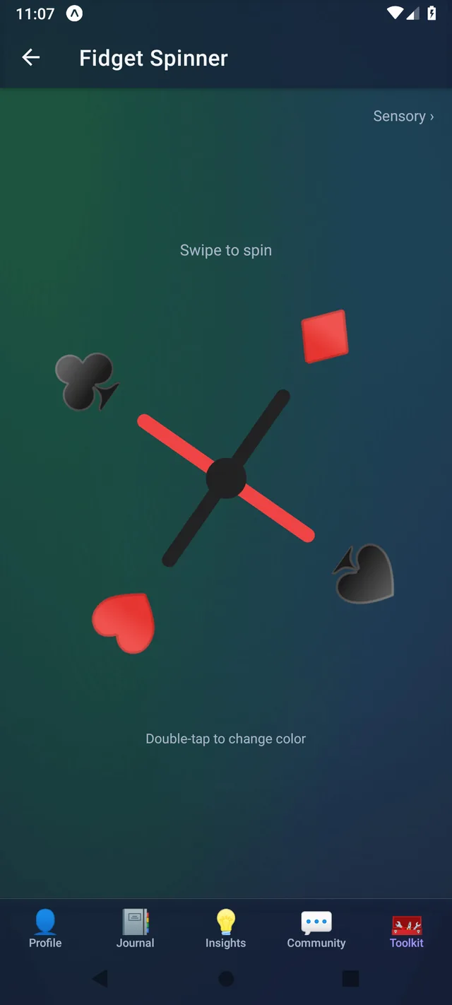 DealtIn Fidget Spinner tool mid-spin, styled with card suits